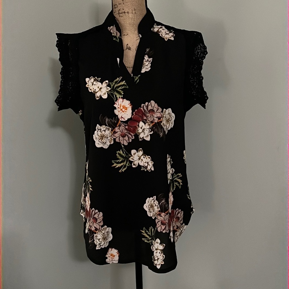 Sleeveless black floral blouse